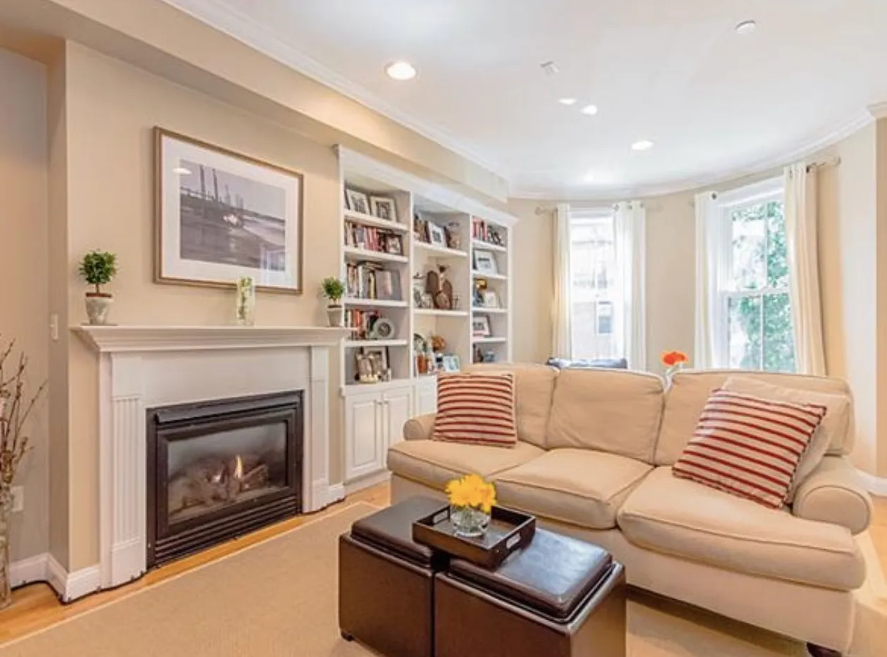 Renovated living room with custom built-ins and bay window, a recent Abrams Builders project on East Brookline Street, Boston