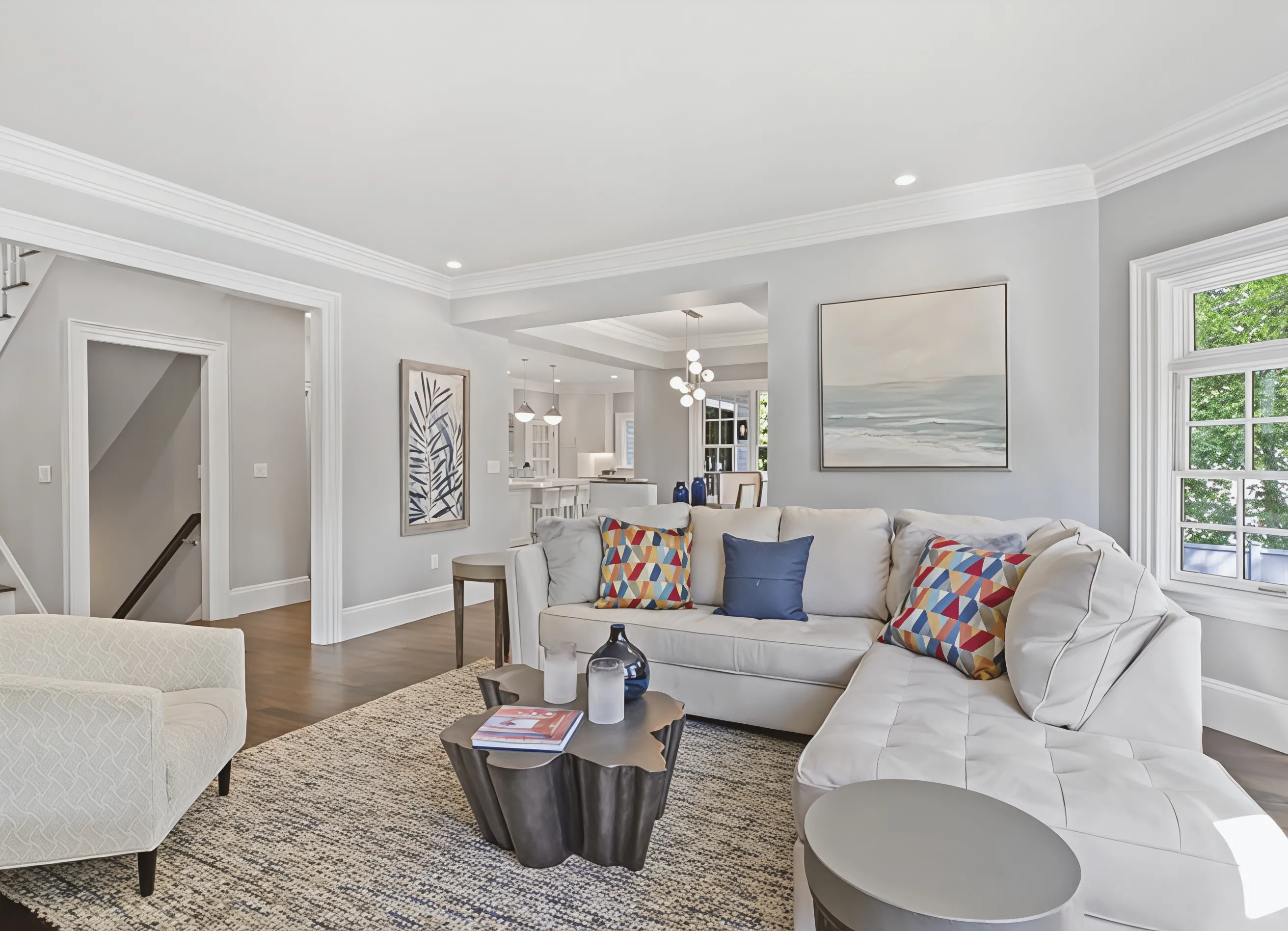 Renovated living room with custom millwork, Gibbs Street project in Newton, MA