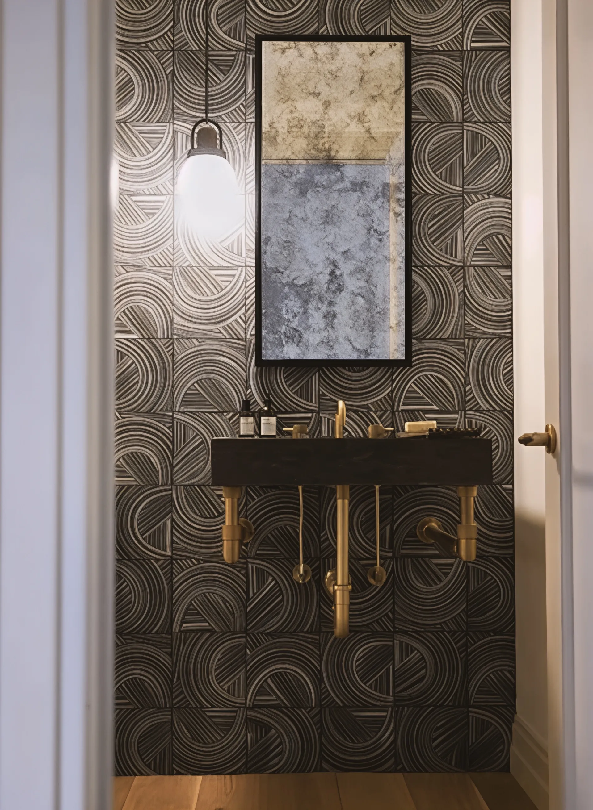 Patterned tile powder room with brass fixtures, Heath Hill Road project in Brookline, MA